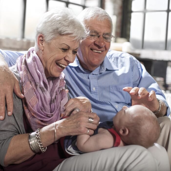 grandparents-playing-with-granddaughter-at-home-2025-04-04-13-07-09-utc-min